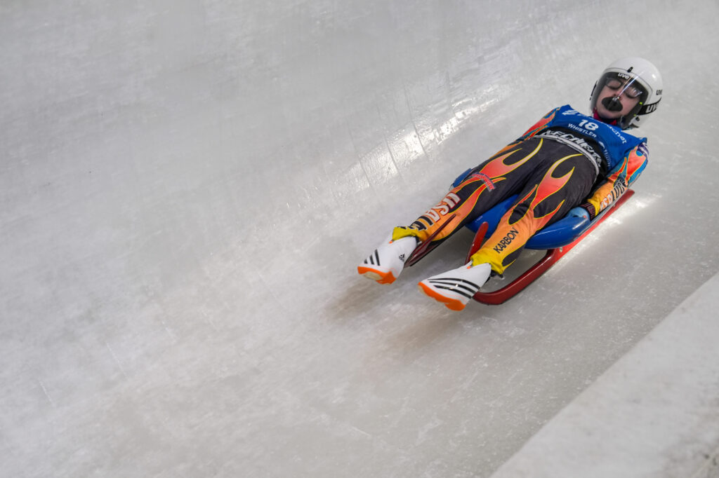 An athlete competing in athletic event sports with helmet