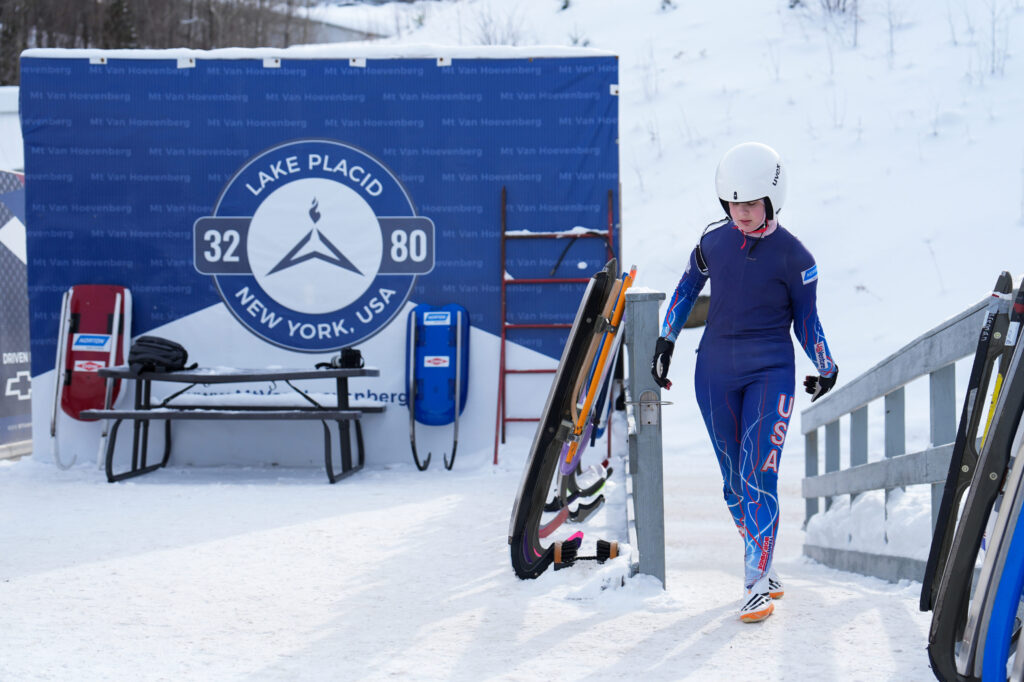 An athlete competing in athletic event sports with helmet in the snow