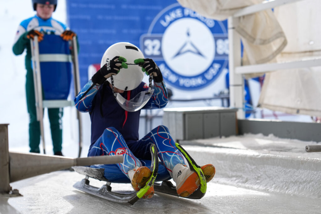 Two athletes competing in athletic event sports with helmet