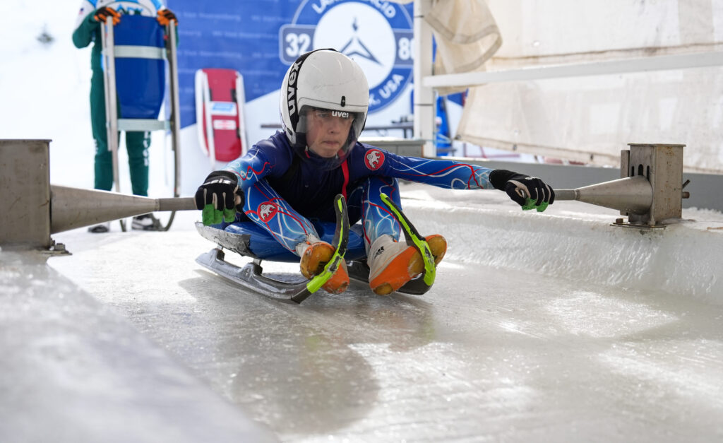 Two athletes competing in athletic event sports with helmet