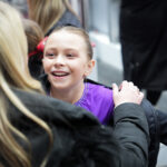 A group of athletes competing in athletic event sports