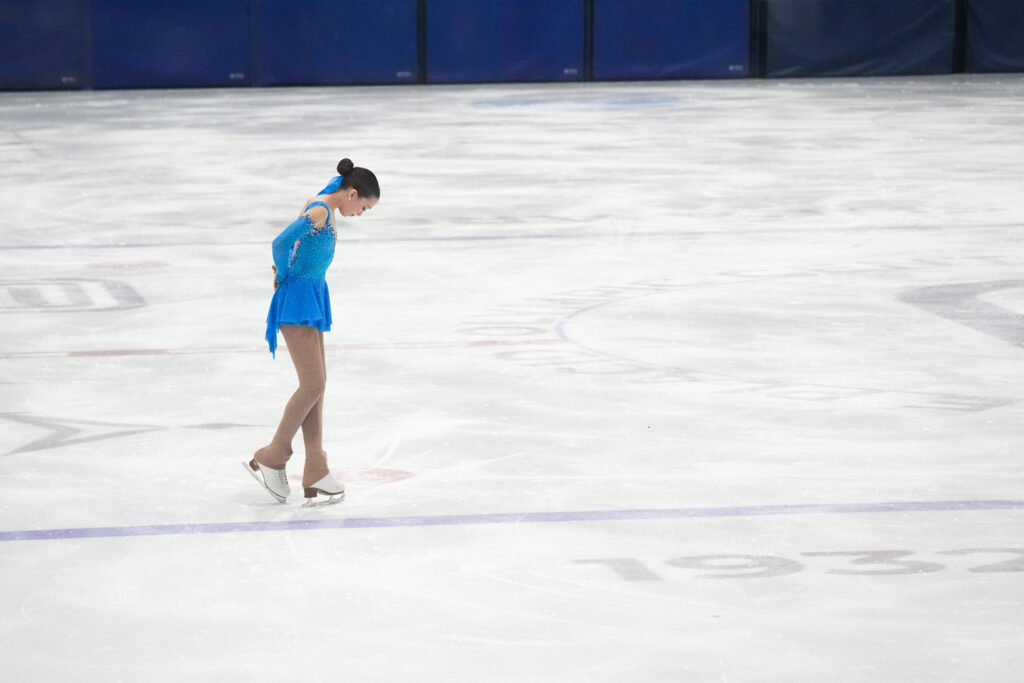 An athlete skating on the rink