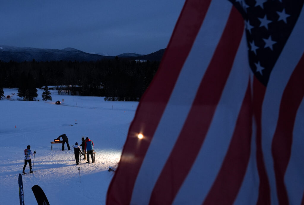 A group of athletes competing in athletic event sports with helmet in the snow