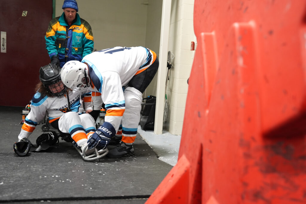 Two athletes competing in athletic event sports with helmet