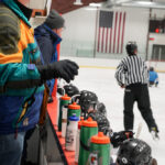 A group of athletes competing in athletic event sports with helmet