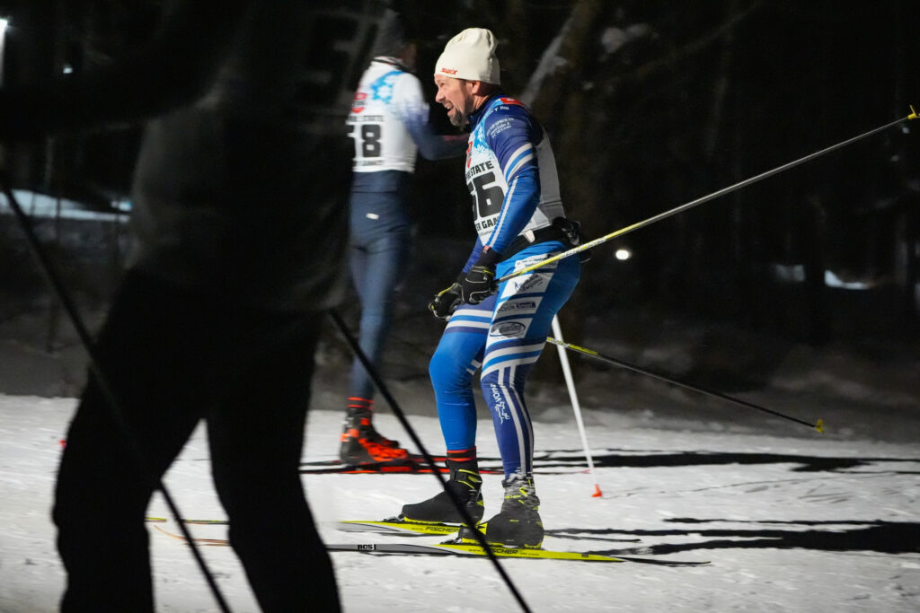 A group of athletes skiing in the snow