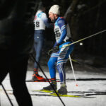 A group of athletes skiing in the snow