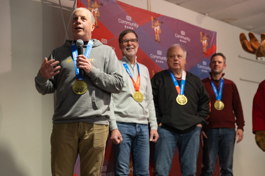 A group of athletes competing in athletic event sports