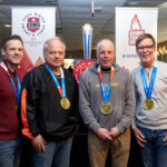 A group of athletes competing in athletic event sports