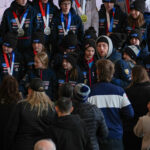 A group of athletes competing in athletic event sports with helmet