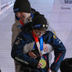 A group of athletes competing in athletic event sports