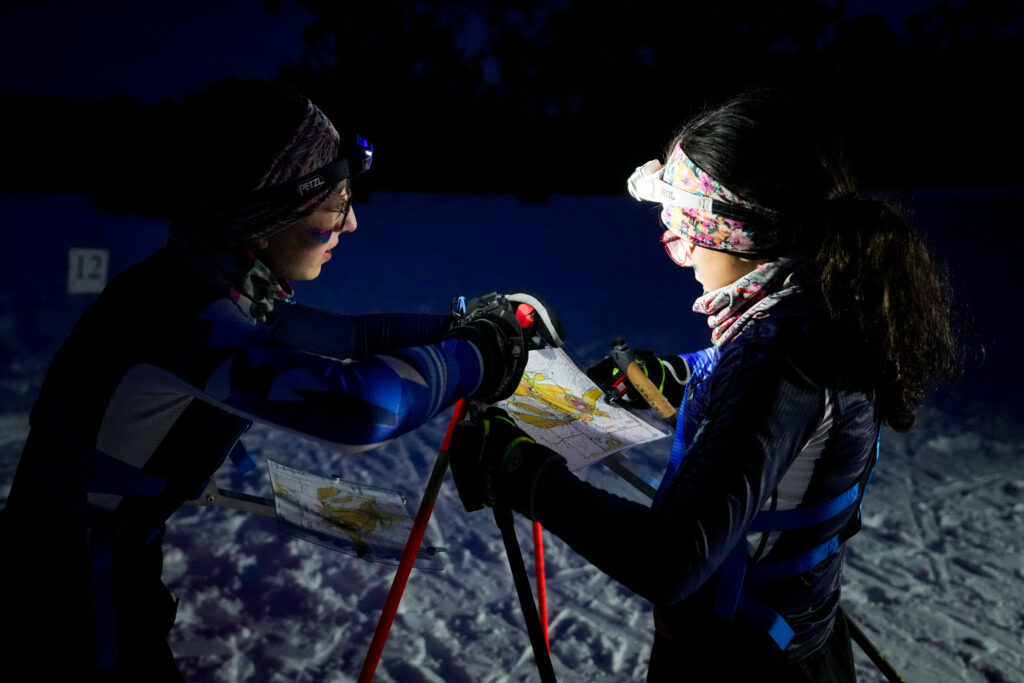 Two athletes competing in athletic event sports in the snow
