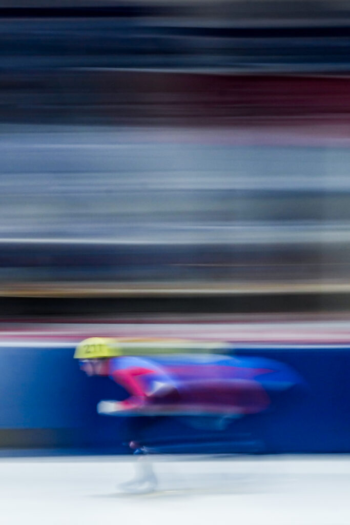 Two athletes competing in athletic event sports with helmet