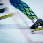 An athlete competing in athletic event sports