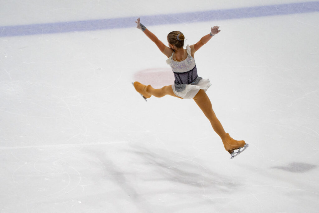 An athlete skating on the rink