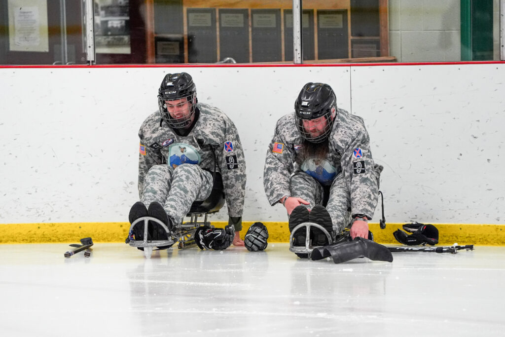 Two athletes competing in athletic event sports with helmet