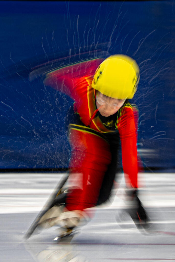 An athlete competing in athletic event sports with helmet in the snow