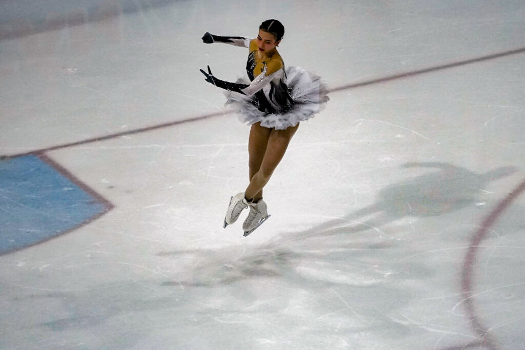 An athlete skating on the rink