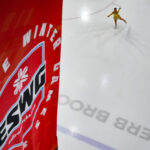 An athlete competing in athletic event sports