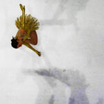 An athlete competing in athletic event sports