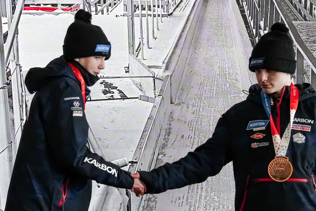 Two athletes competing in athletic event sports