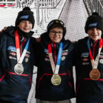 A group of athletes competing in athletic event sports