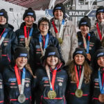 A group of athletes competing in athletic event sports