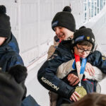 A group of athletes competing in athletic event sports