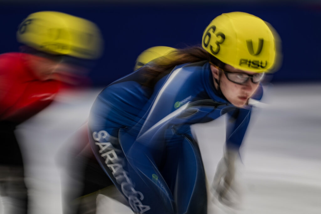 Two athletes competing in athletic event sports with helmet