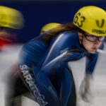 Two athletes competing in athletic event sports with helmet