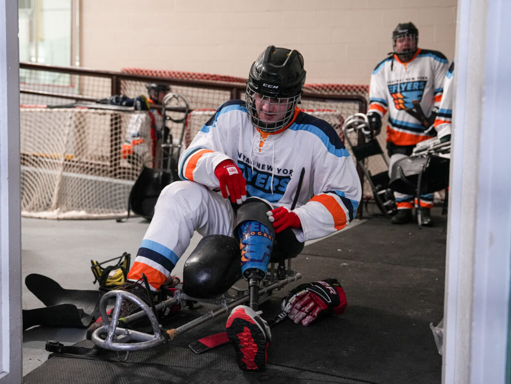 Two athletes competing in athletic event sports with helmet