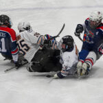 A group of athletes skating with helmet on the rink