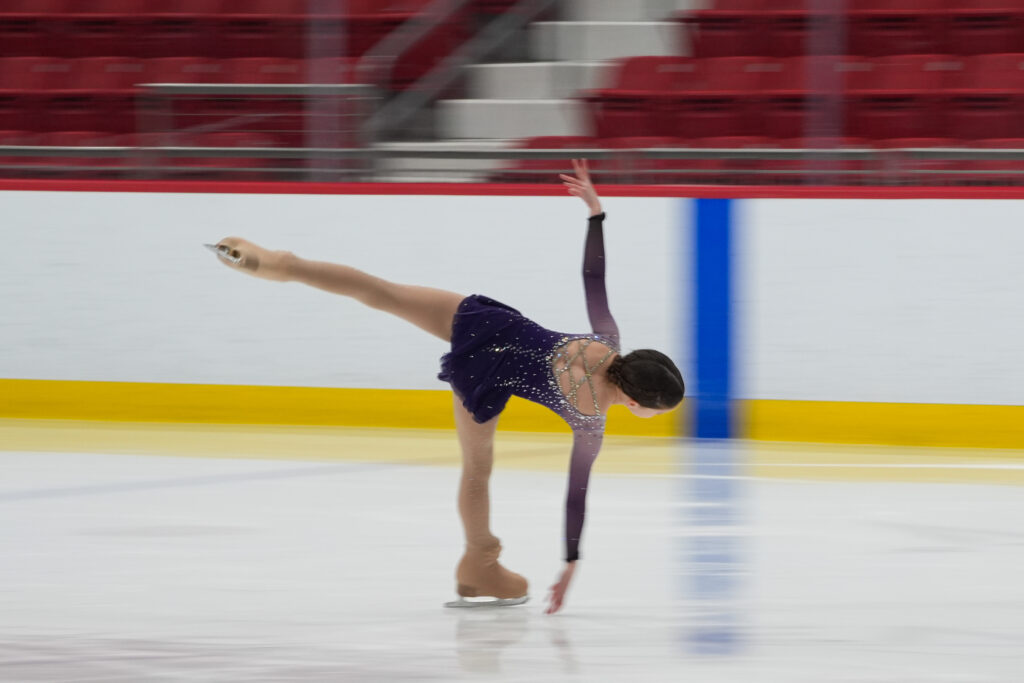 An athlete skating on the rink