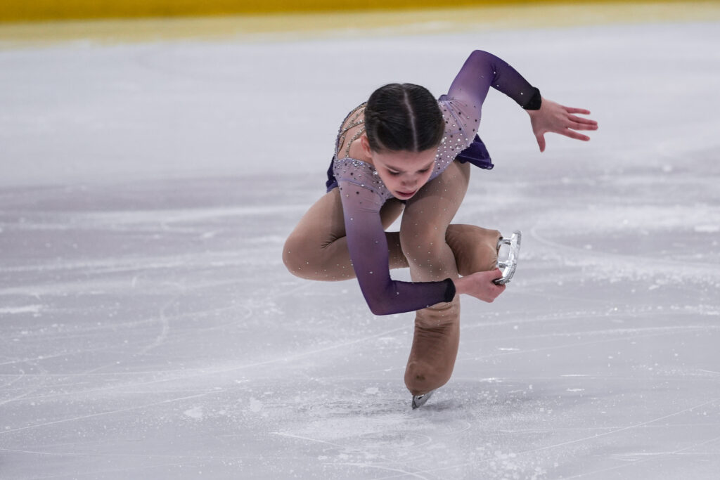An athlete skating on the rink