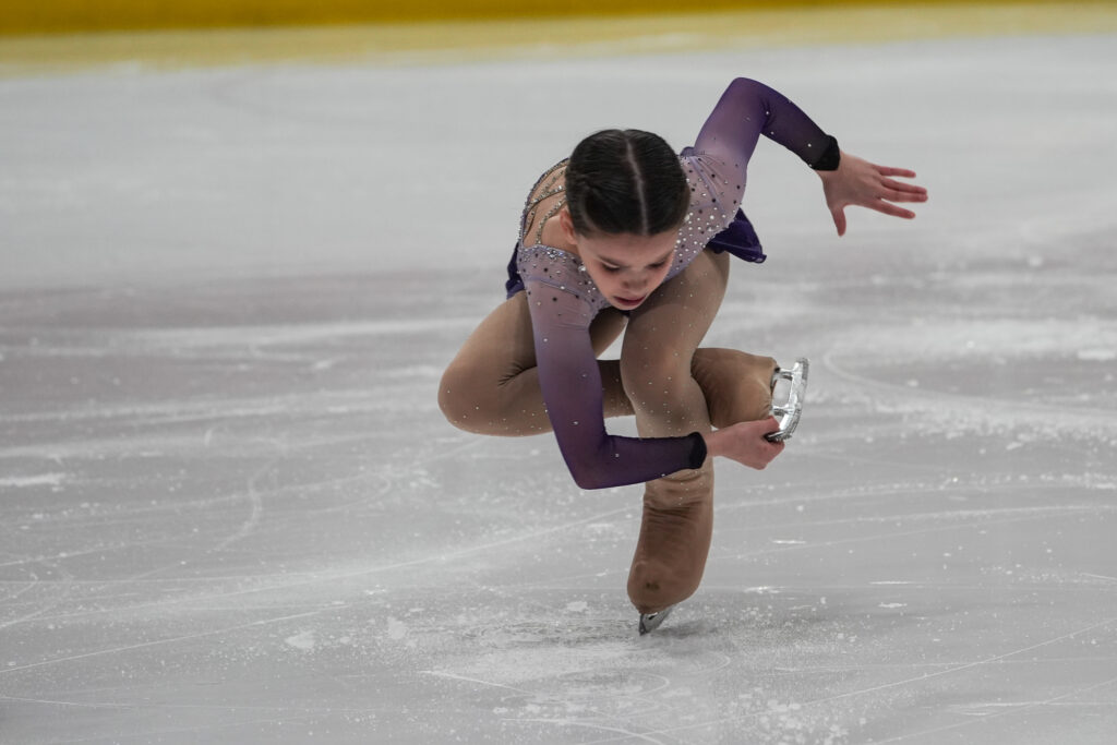 An athlete skating on the rink