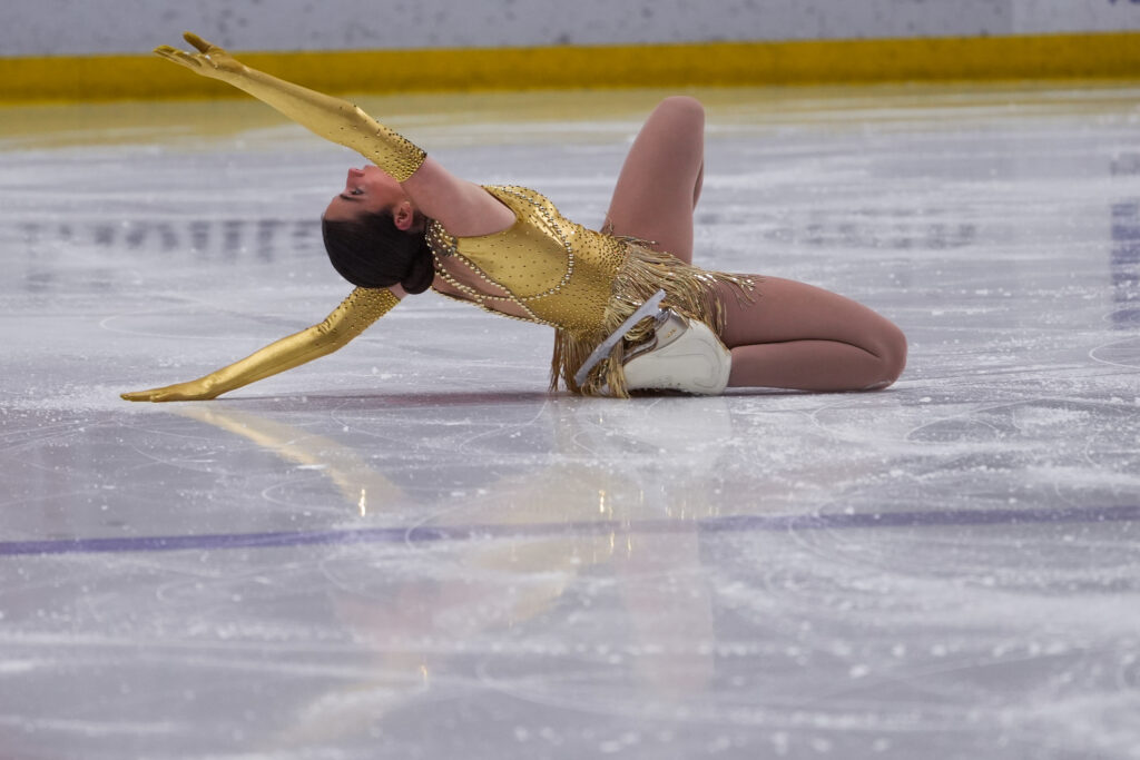 An athlete skating on the rink
