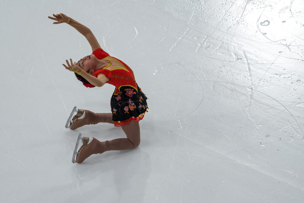 An athlete skating on the rink