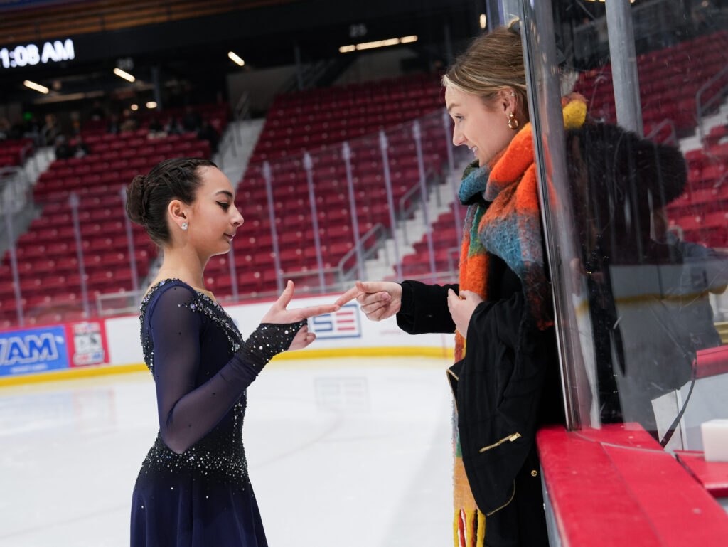 A group of athletes skating on the rink