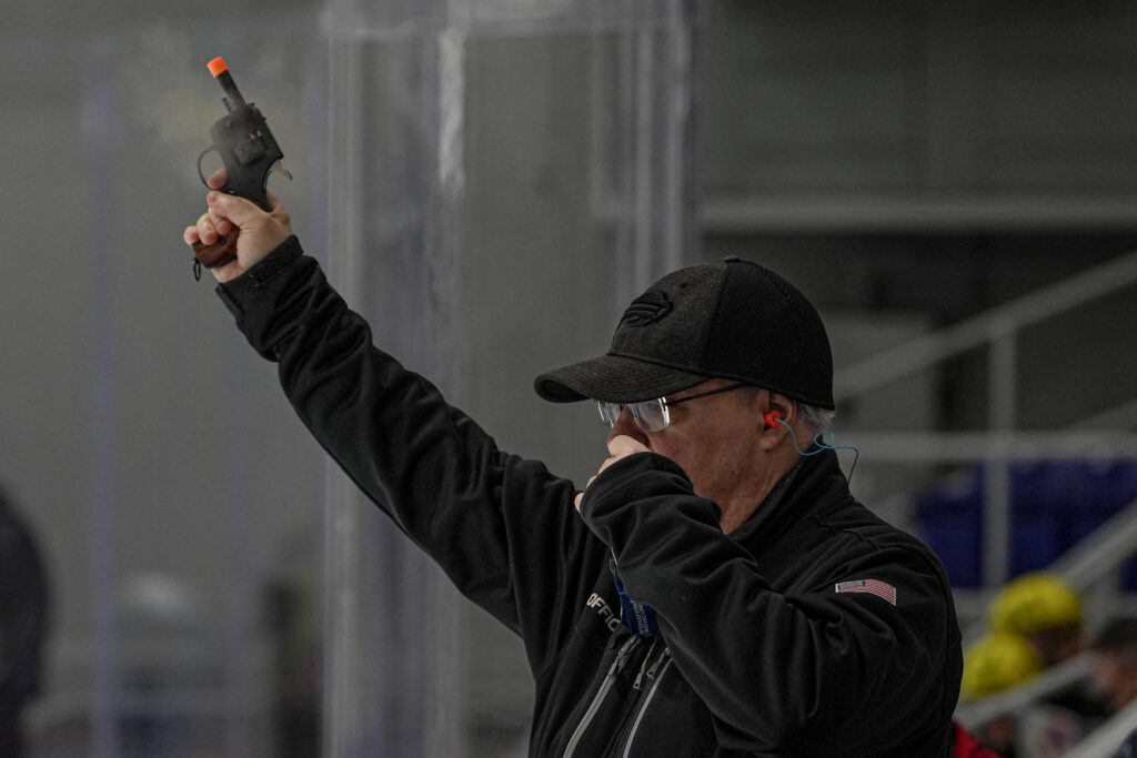 An athlete competing in athletic event sports