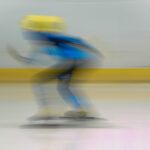 An athlete competing in athletic event sports with helmet