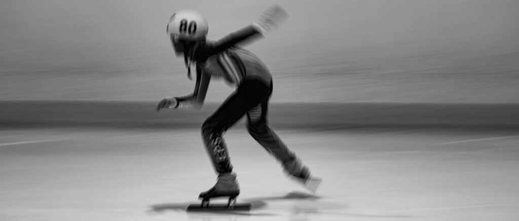 An athlete playing football with helmet on the field