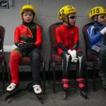 A group of athletes competing in athletic event sports with helmet