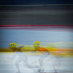 Two athletes skating on the rink
