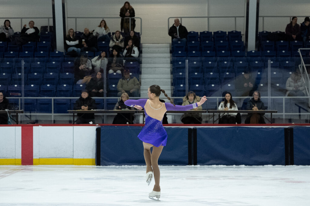 A group of athletes skating on the rink
