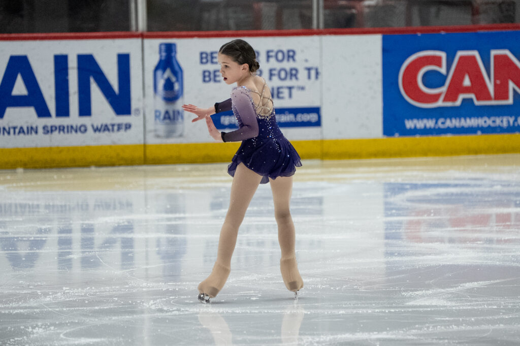 An athlete skating on the rink