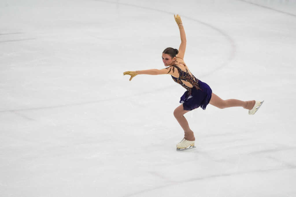 An athlete skating on the rink