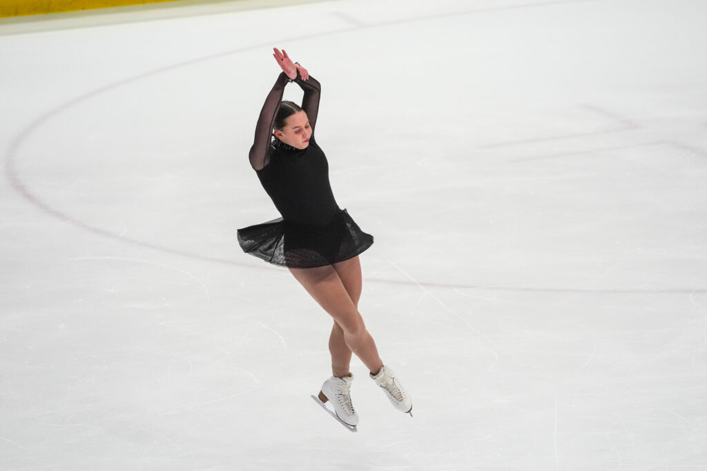 An athlete skating on the rink