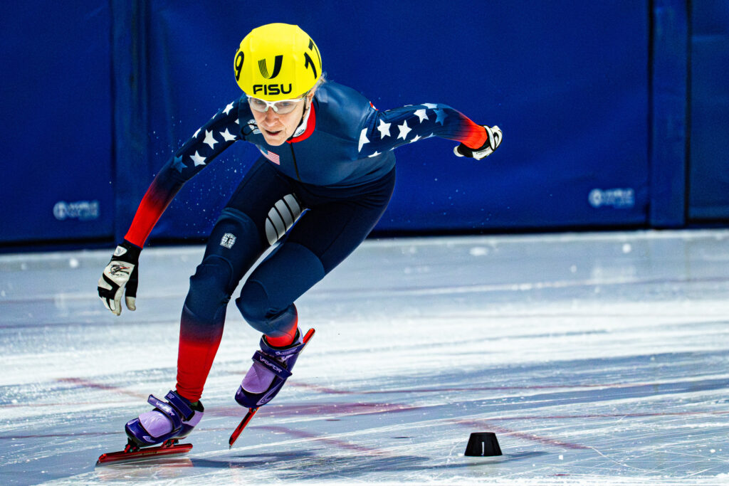 An athlete skating with helmet