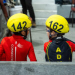 A group of athletes competing in athletic event sports with helmet