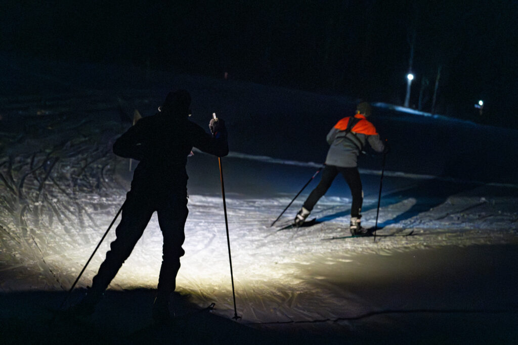 Two athletes competing in athletic event sports in the snow